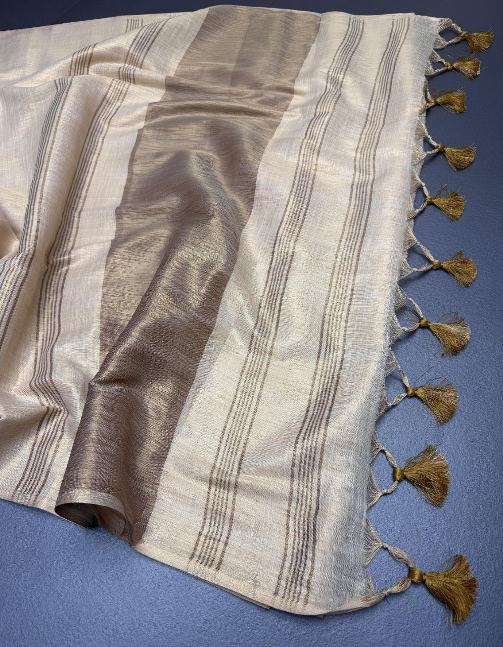 Off white with brown accents striped Pallu mysore silk fabric  with tassels  